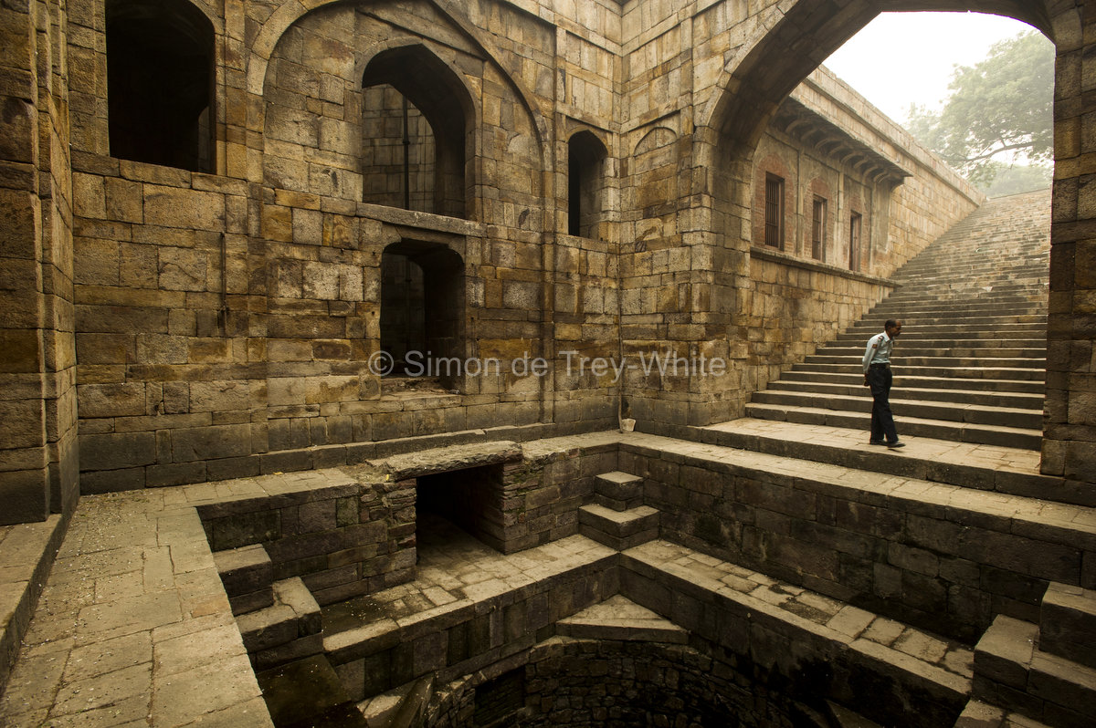 View of the well and steps leading up to the west at the Red Fort baoli