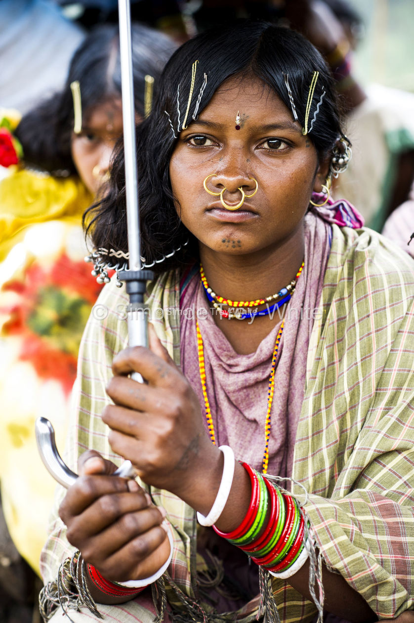 A girl of the Dongria Kondh tribe listens to proceedings from the Gram Sabha meeting hall in Lakhapadar village in the Niyamgiri Hills on the 7th August 2013